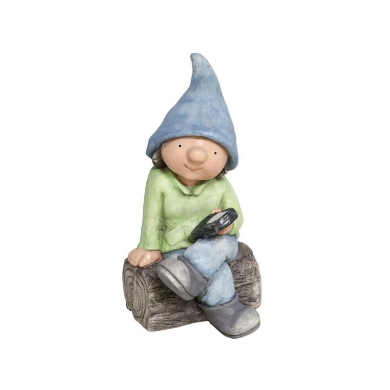 NIÑO SENTADO EN TRONCO 42.5X21X22.5 CM